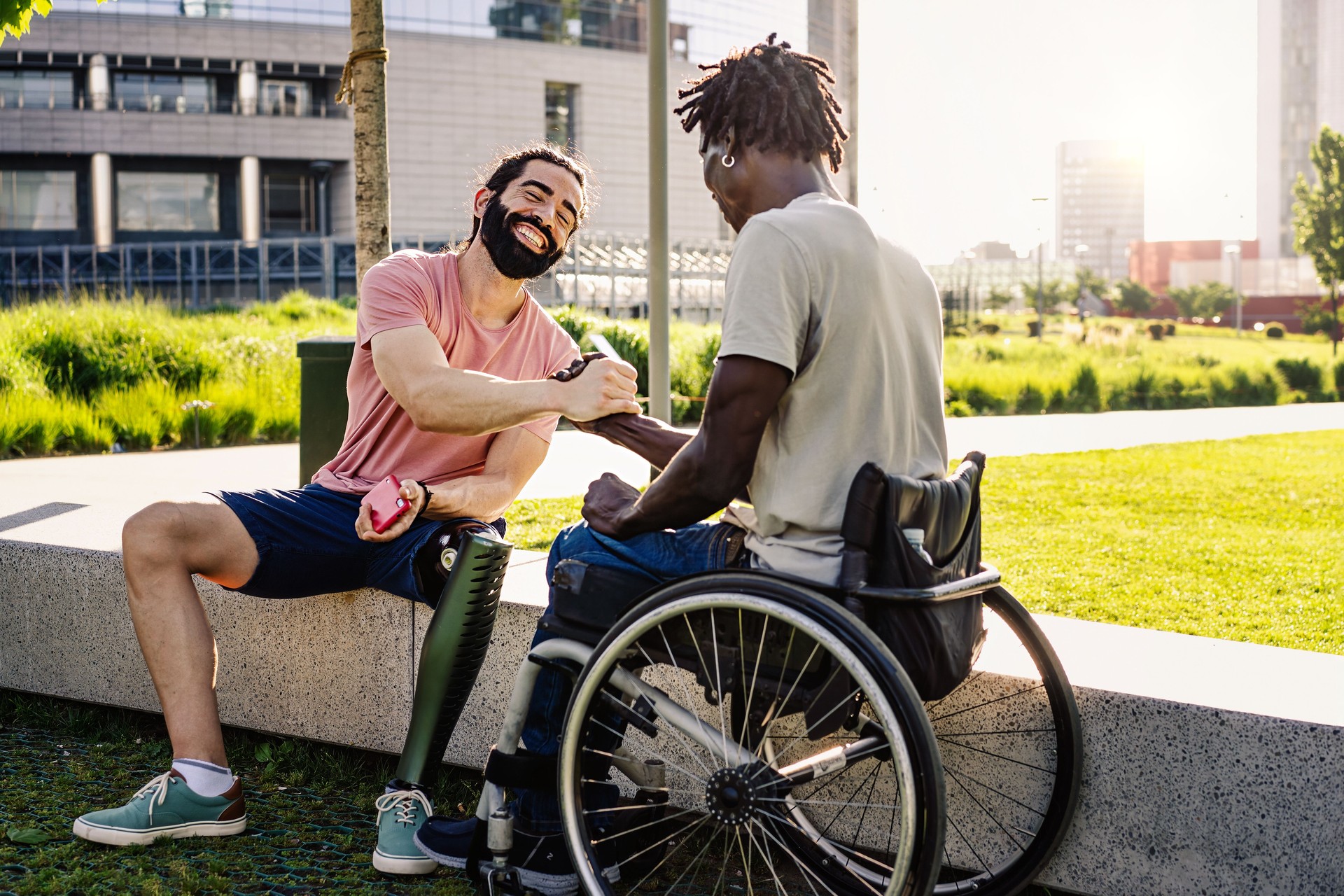 Friends with disabilities shaking hands